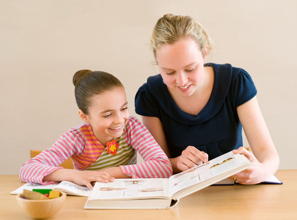 A person tutoring a kid